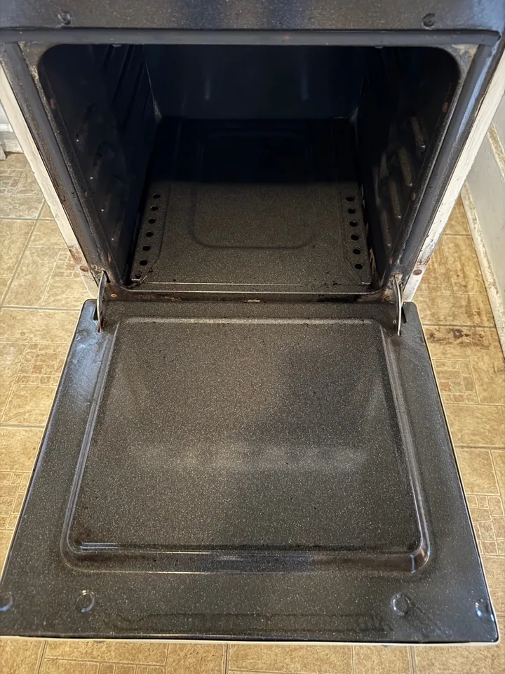 Same oven interior after a Swept Up move-out clean