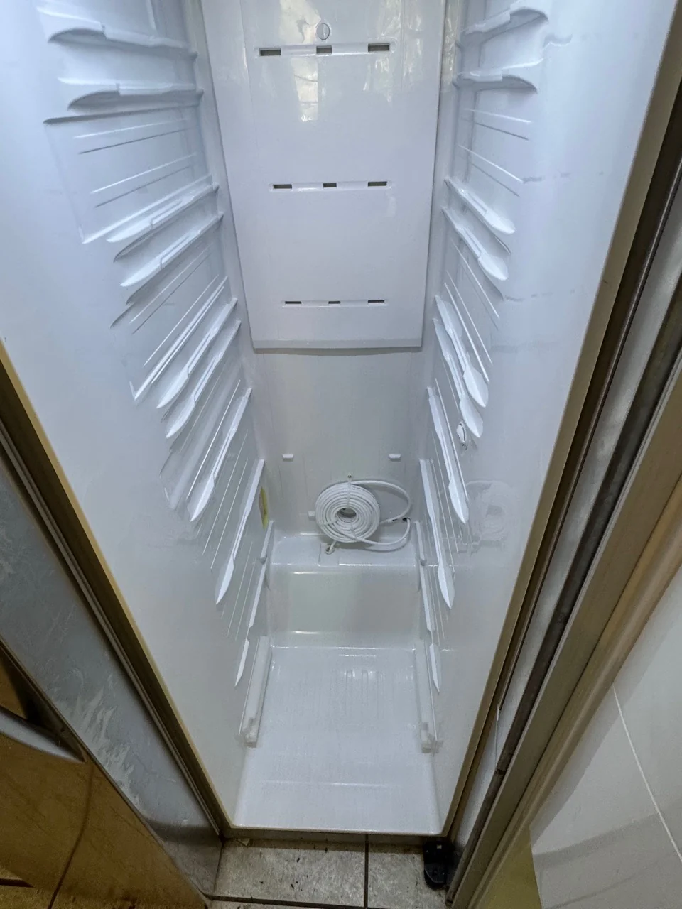 Same fridge interior after a Swept Up move-out clean
