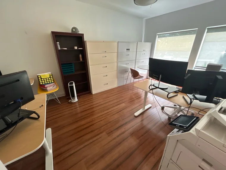 Office with desks and filing cabinets after cleaning