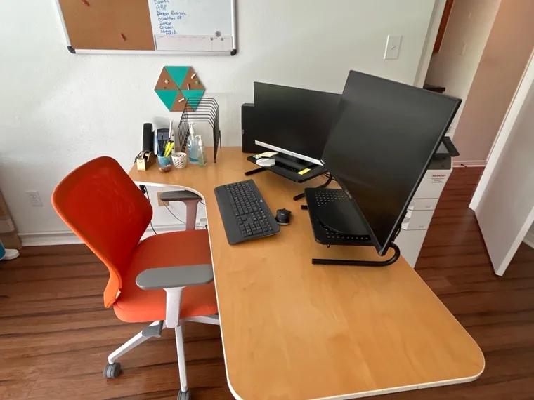 Workspace desk and monitors after an office clean